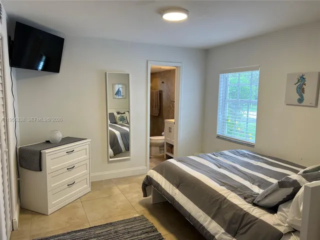 a bedroom with a bed and furniture