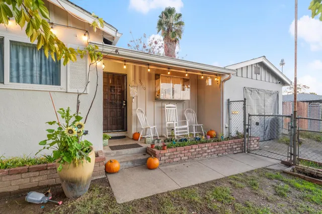 a kitchen with a sink stove top oven and cabinets