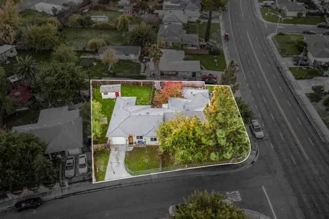 an aerial view of a house with a garden