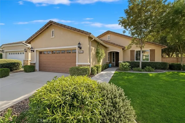 a front view of a house with a yard and porch