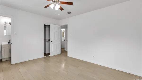 a bathroom with a sink toilet and a mirror