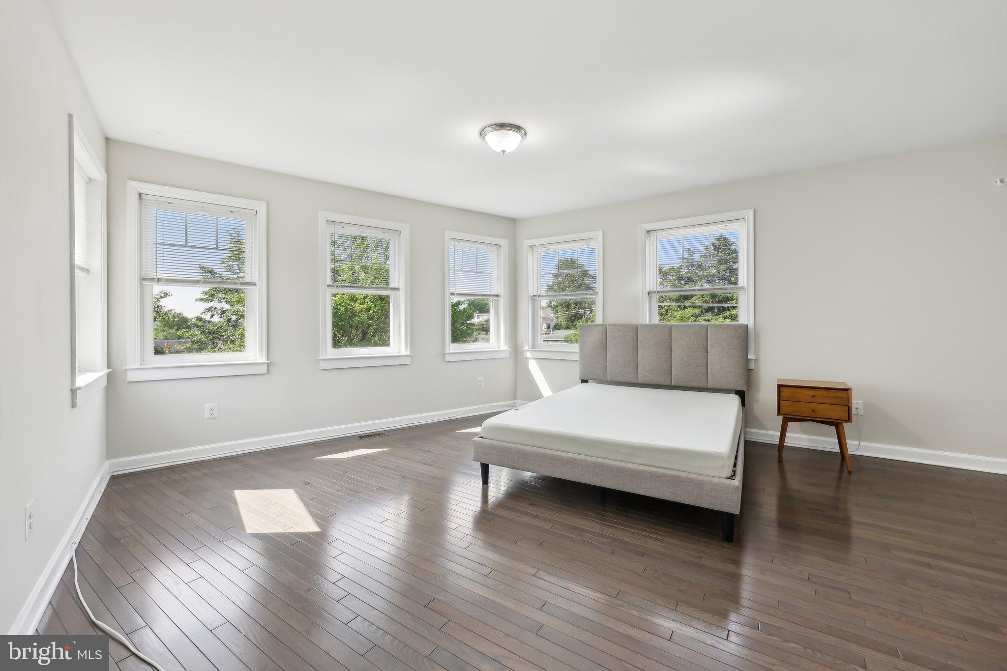 1905 South Glebe Road Arlington, VA 22204 - Photo 32 of 50 a bedroom with wooden floor and a window