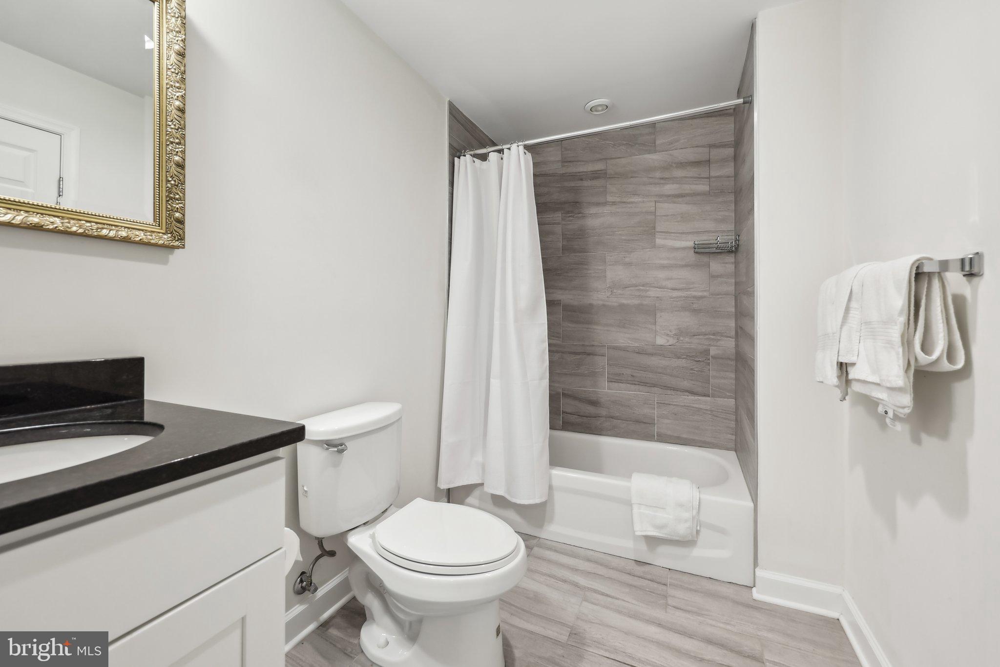1905 South Glebe Road Arlington, VA 22204 - Photo 43 of 50 a bathroom with a sink toilet and shower