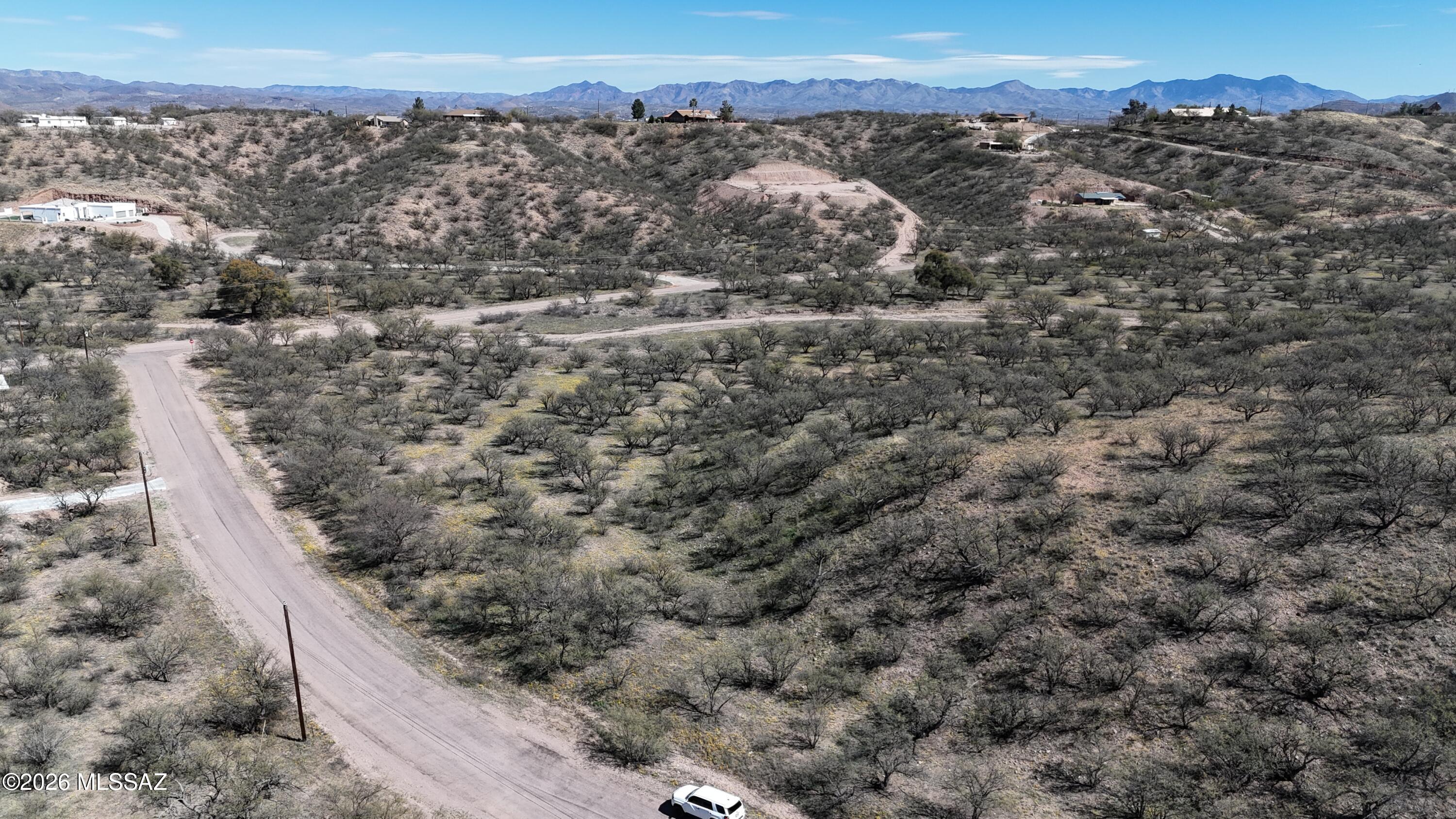 561 Mulberry Court, Unit 80 Rio Rico, AZ 85648 - Photo 6 of 13 an aerial view of residential house and car parked