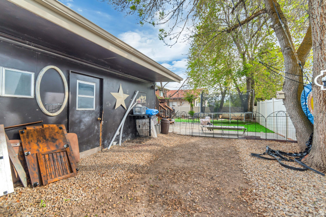 7470 Ramanee Drive Midvale, UT 84047 - Photo 29 of 29 Fenced backyard with a trampoline
