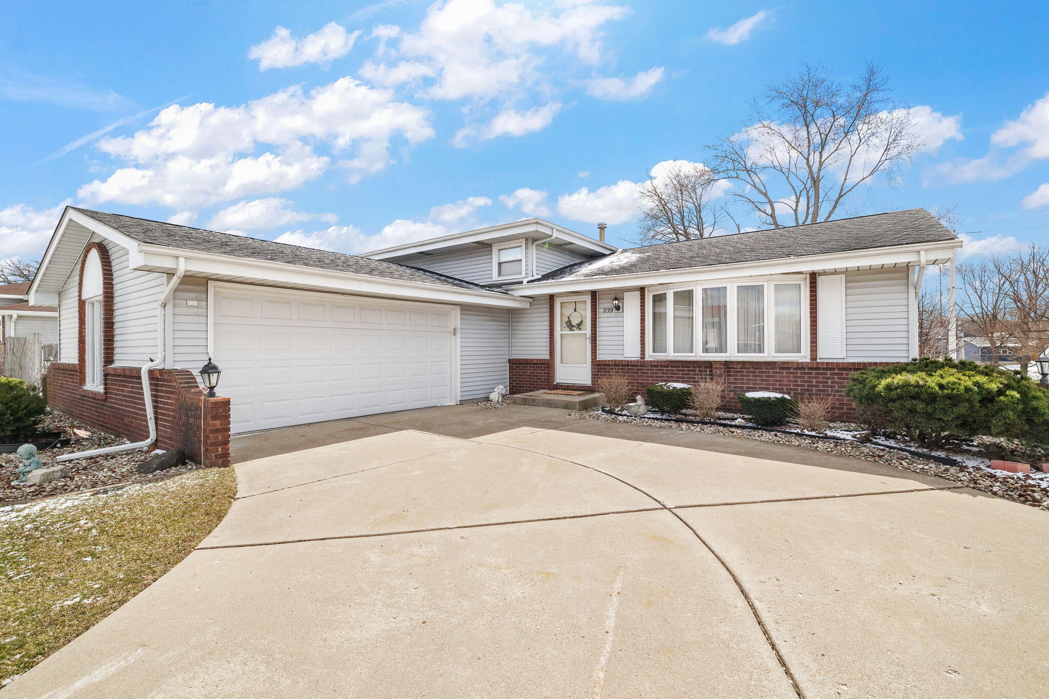 a front view of a house with yard
