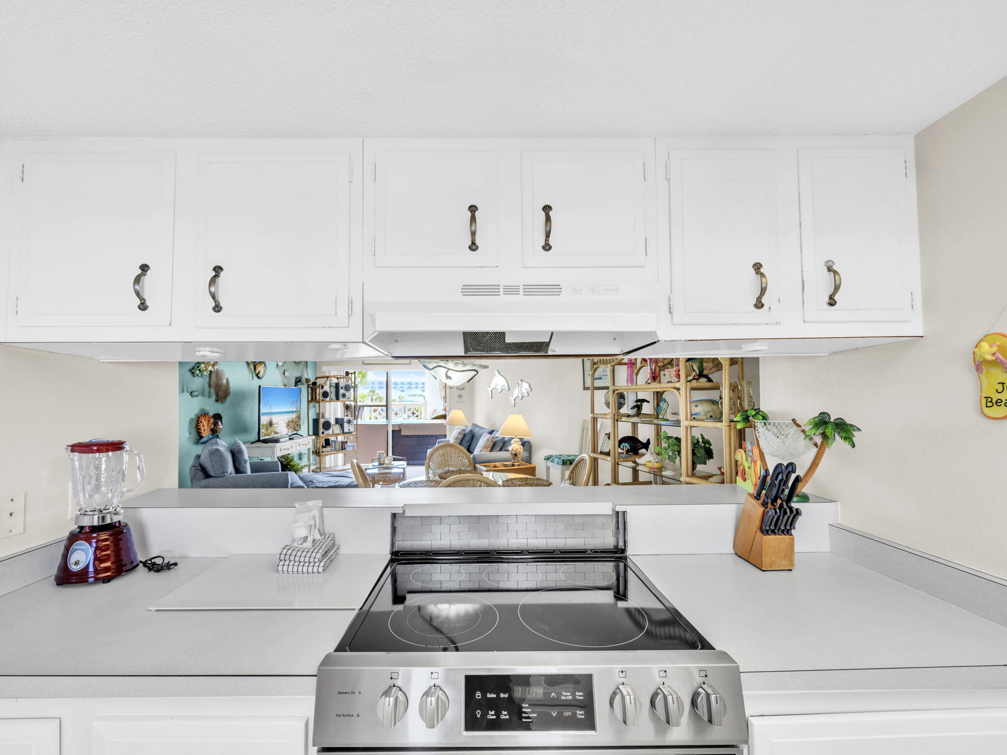 909 Santa Rosa Boulevard, Unit 235 Fort Walton Beach, FL 32548 - Photo 13 of 30 a kitchen with a stove and cabinets