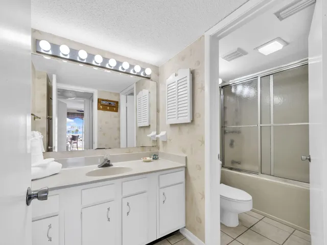 a large white bed in a bedroom