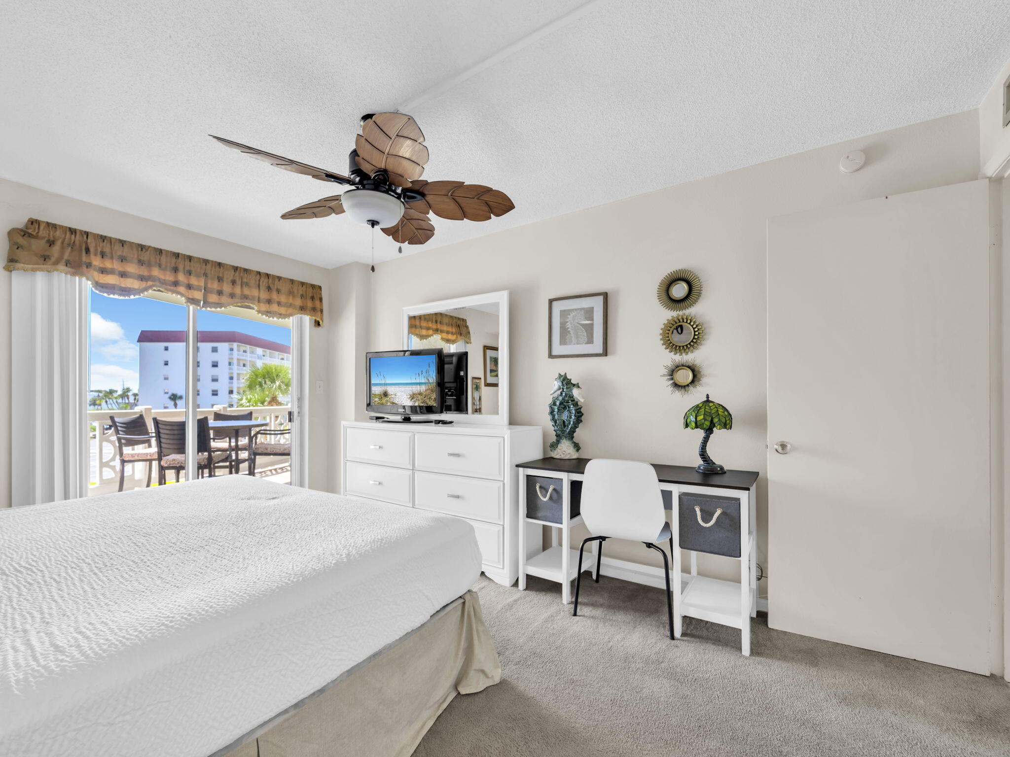 909 Santa Rosa Boulevard, Unit 235 Fort Walton Beach, FL 32548 - Photo 23 of 30 a large white bed in a bedroom