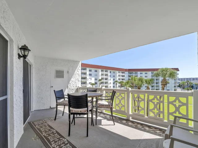 a view of a swimming pool with a yard