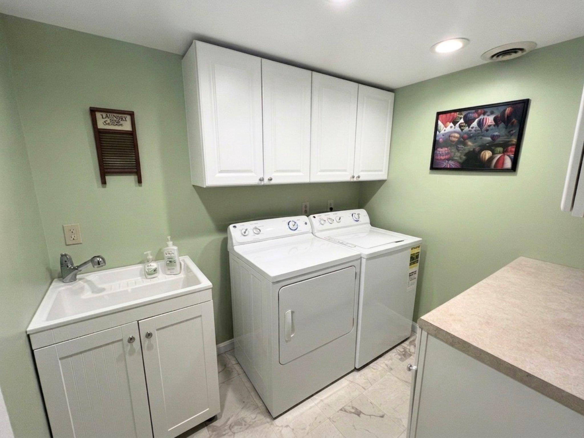 8531 Solomons Island Road North Owings, MD 20736 - Photo 9 of 12 a utility room with dryer and washer