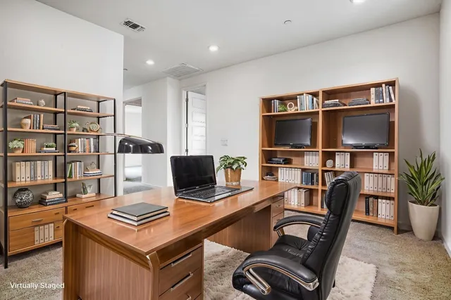 a view of a workspace with furniture