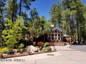 3721 Horseshoe Loop Show Low, AZ 85901 - Photo 1 of 44 front view of a house with a tree