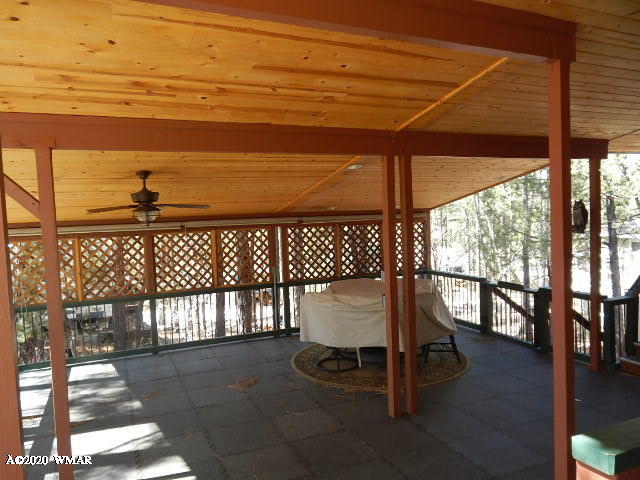 3721 Horseshoe Loop Show Low, AZ 85901 - Photo 11 of 44 a view of a chairs and table in the patio