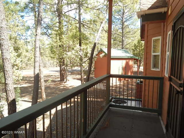 3721 Horseshoe Loop Show Low, AZ 85901 - Photo 16 of 44 a view of balcony with wooden floor and fence
