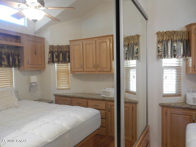 3721 Horseshoe Loop Show Low, AZ 85901 - Photo 26 of 44 a bedroom with a bed and a window