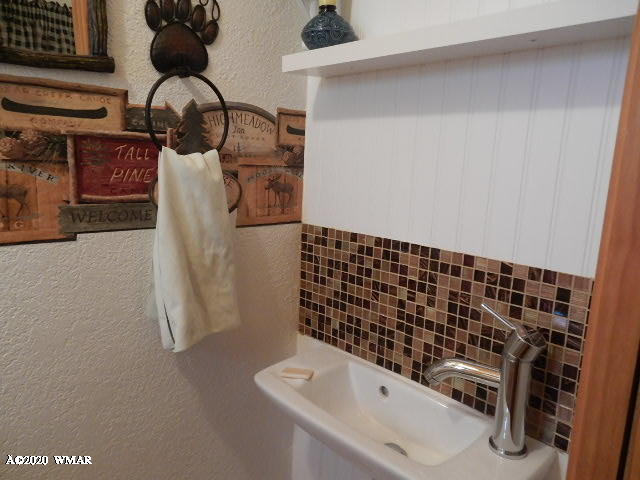 3721 Horseshoe Loop Show Low, AZ 85901 - Photo 30 of 44 a bathroom with a sink