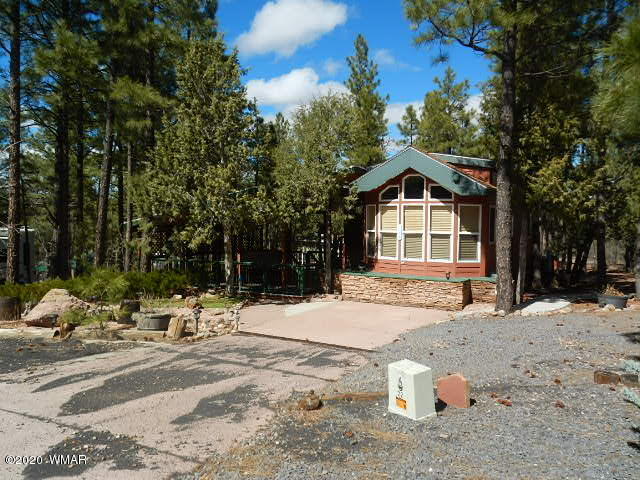 3721 Horseshoe Loop Show Low, AZ 85901 - Photo 3 of 44 a front view of a house with a yard