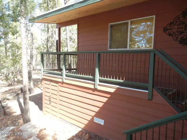 3721 Horseshoe Loop Show Low, AZ 85901 - Photo 37 of 44 a view of a balcony with wooden floor and fence