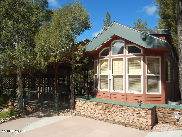 3721 Horseshoe Loop Show Low, AZ 85901 - Photo 9 of 44 a front view of a house with a yard