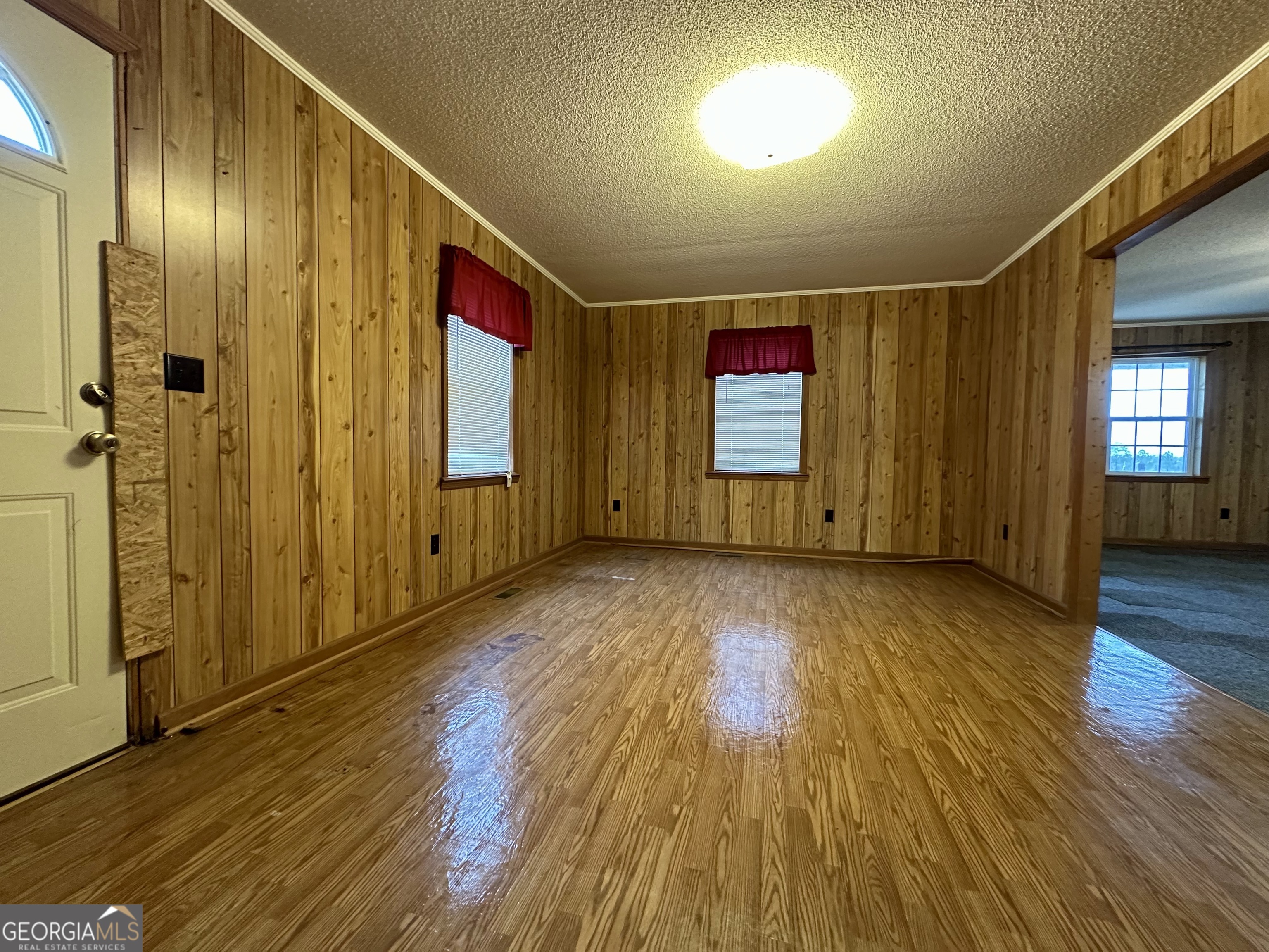 74 Community Church Road McRae-Helena, GA 31037 - Photo 5 of 31 wooden floor in an empty room with a window