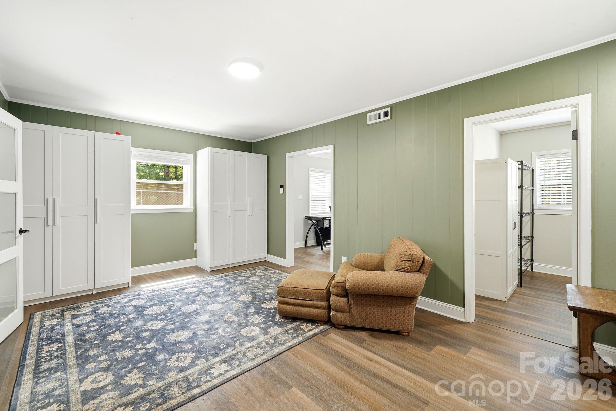 7552 Idlewild Road Charlotte, NC 28212 - Photo 16 of 40 a living room with furniture and a window