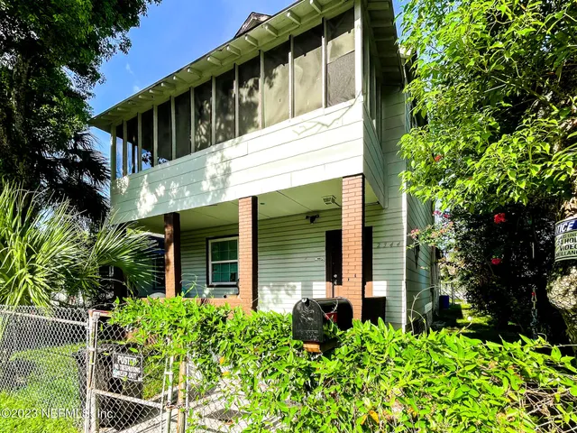 front view of a house with a garden