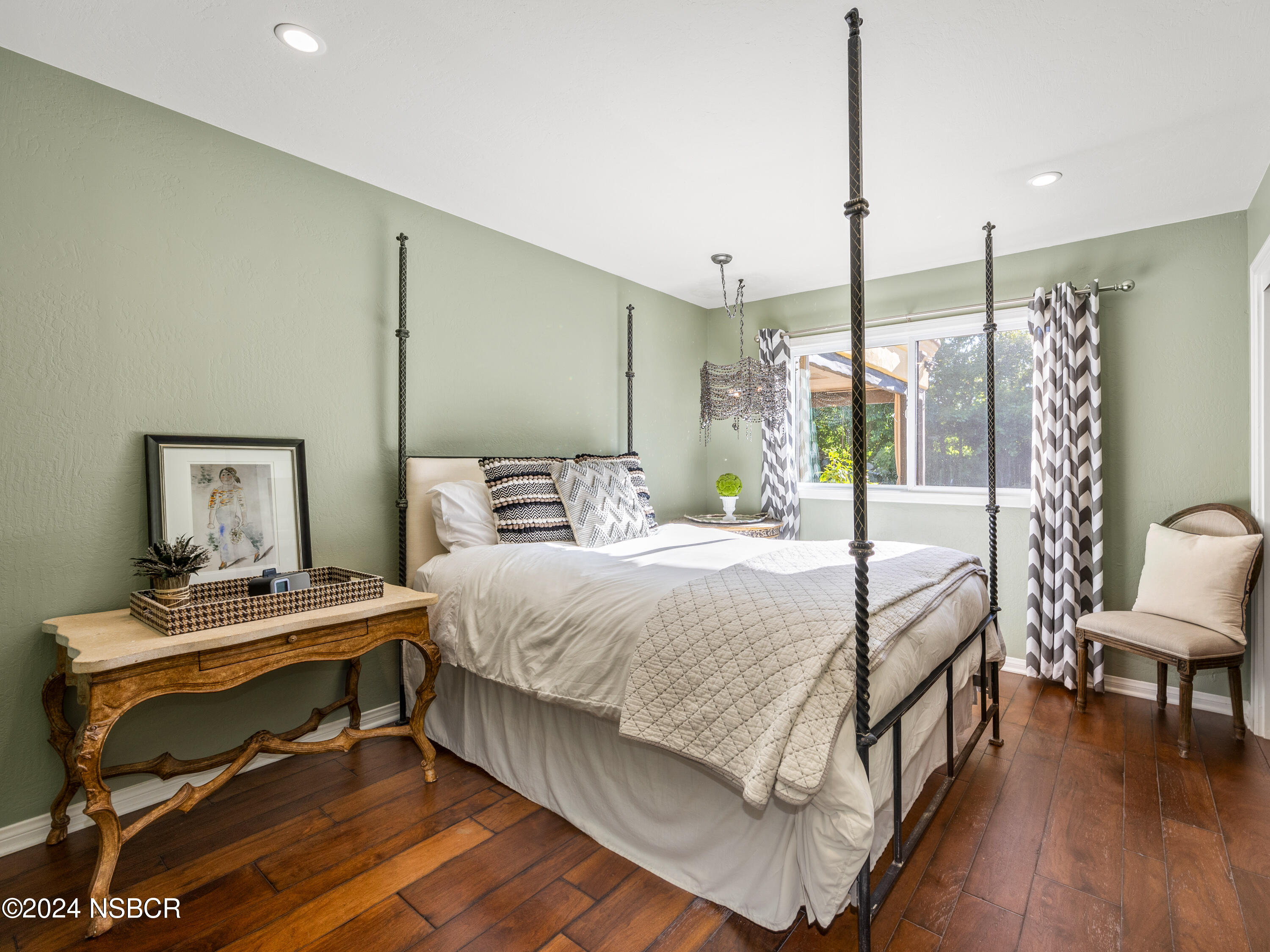 Undisclosed Address Santa Ynez, CA 93460 - Photo 11 of 43 a bedroom with a bed a table and painting on the wall