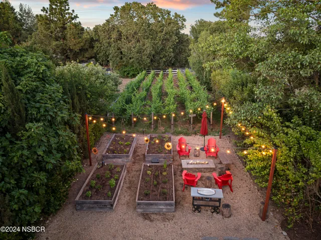 a play ground with potted plants in front of it