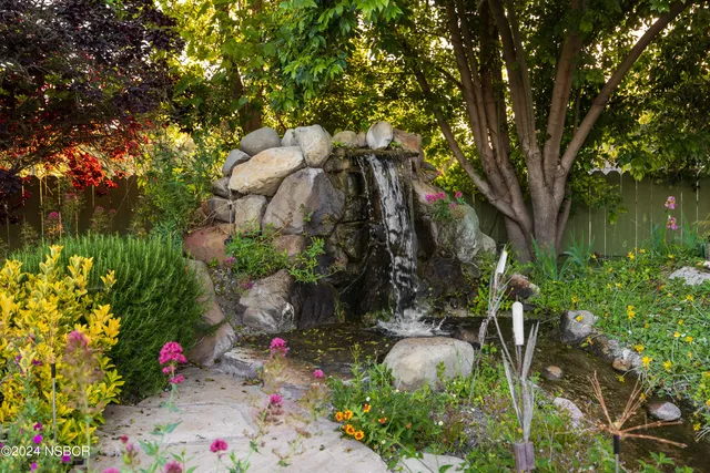 a backyard of a house with lots of green space
