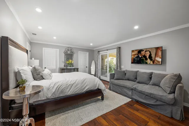 a bedroom with a bed and a couch