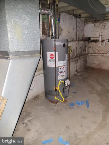 a view of a yard with a house and large trees