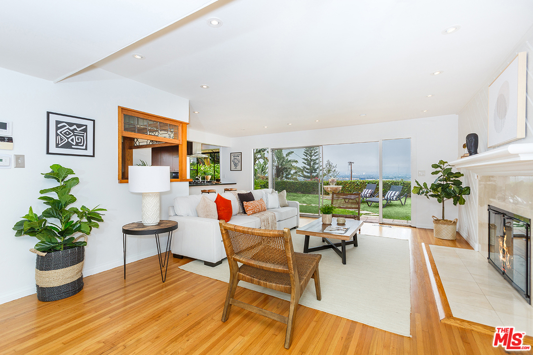 8257 Rees Street Playa del Rey, CA 90293 - Photo 1 of 40 a living room with furniture floor to ceiling window and wooden floor