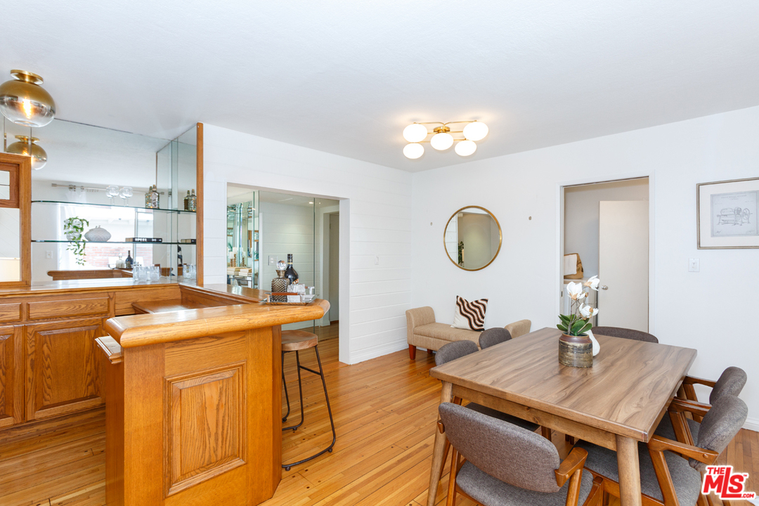 8257 Rees Street Playa del Rey, CA 90293 - Photo 14 of 40 a view of a dining room with furniture window and wooden floor