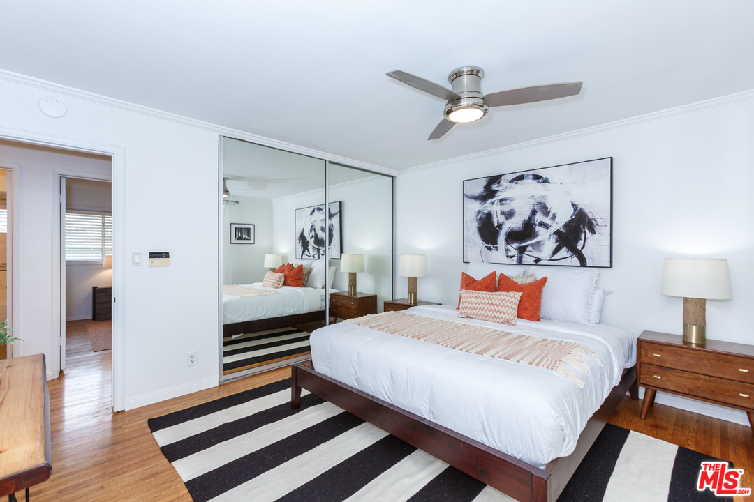8257 Rees Street Playa del Rey, CA 90293 - Photo 20 of 40 a bedroom with a bed and a painting on the wall
