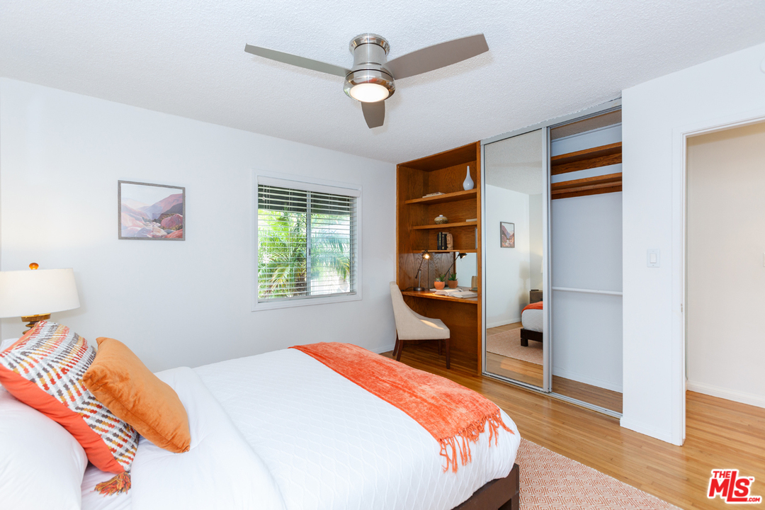 8257 Rees Street Playa del Rey, CA 90293 - Photo 25 of 40 a bedroom with a bed and a chandelier