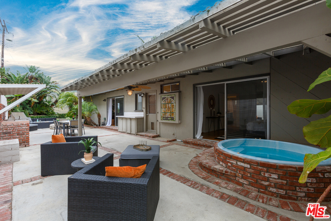 8257 Rees Street Playa del Rey, CA 90293 - Photo 31 of 40 a backyard of a house with sofas table and chairs