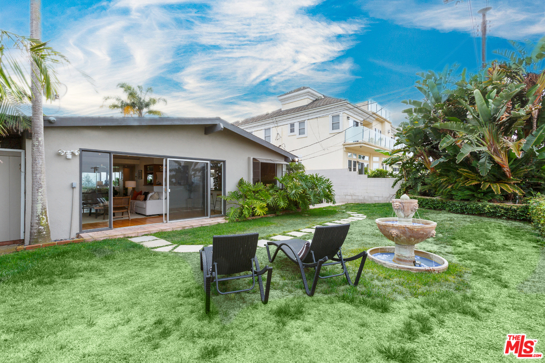 8257 Rees Street Playa del Rey, CA 90293 - Photo 36 of 40 a view of a chair and table in backyard of the house