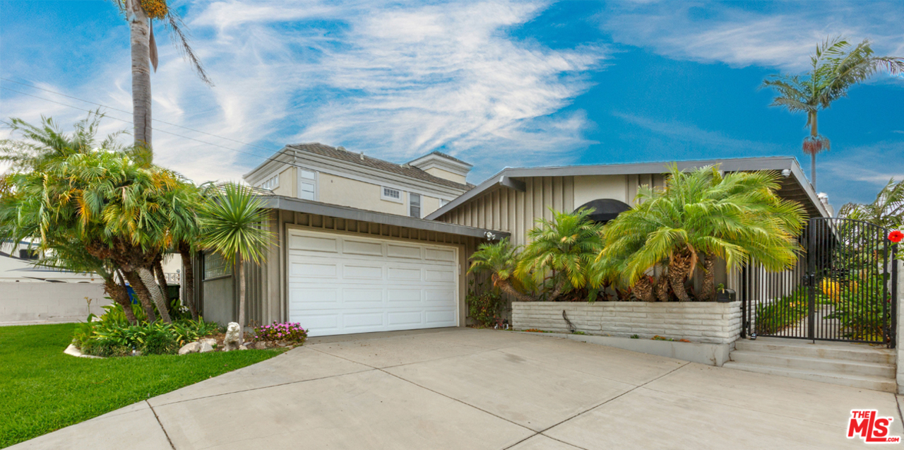 8257 Rees Street Playa del Rey, CA 90293 - Photo 39 of 40 a house with a tree in front of it