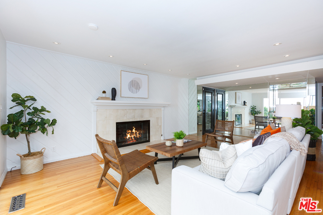 8257 Rees Street Playa del Rey, CA 90293 - Photo 5 of 40 a living room with furniture and a fireplace