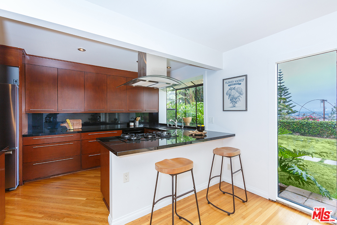 8257 Rees Street Playa del Rey, CA 90293 - Photo 8 of 40 a kitchen with stainless steel appliances granite countertop a stove a sink and a refrigerator