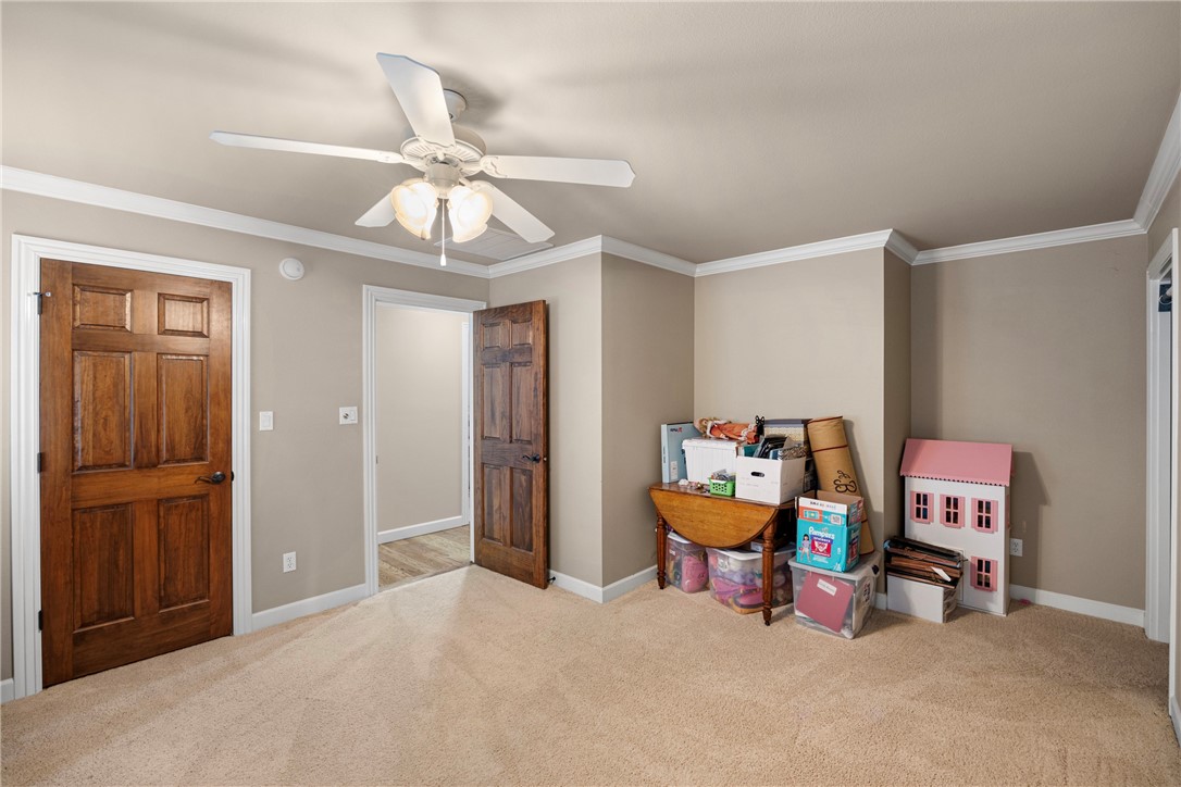 788 Cliff Road Russellville, AR 72802 - Photo 37 of 60 Recreation room featuring light colored carpet, crown molding, and a ceiling fan