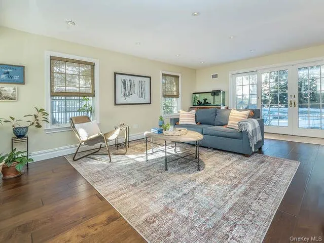 a living room with furniture and a rug
