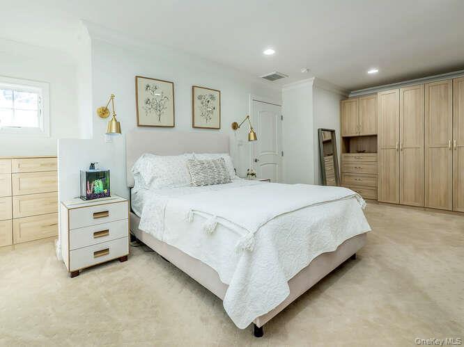 23 Ivy Way Port Washington, NY 11050 - Photo 23 of 47 a bedroom with a bed and a window