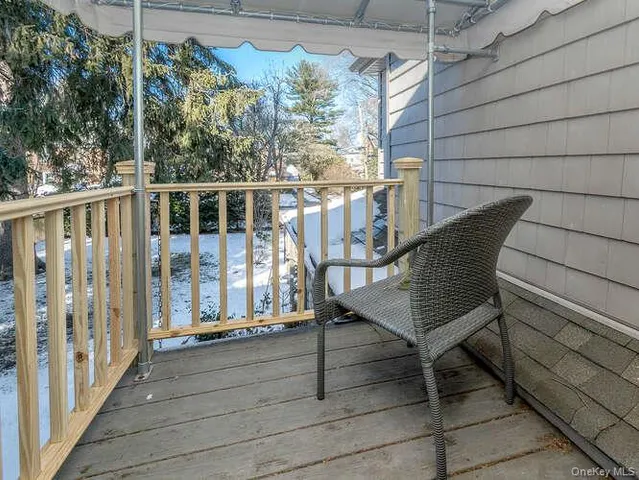 a view of a chairs on the roof deck