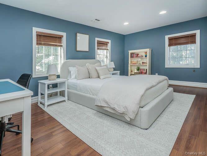 23 Ivy Way Port Washington, NY 11050 - Photo 35 of 47 a bedroom with a large bed and a window