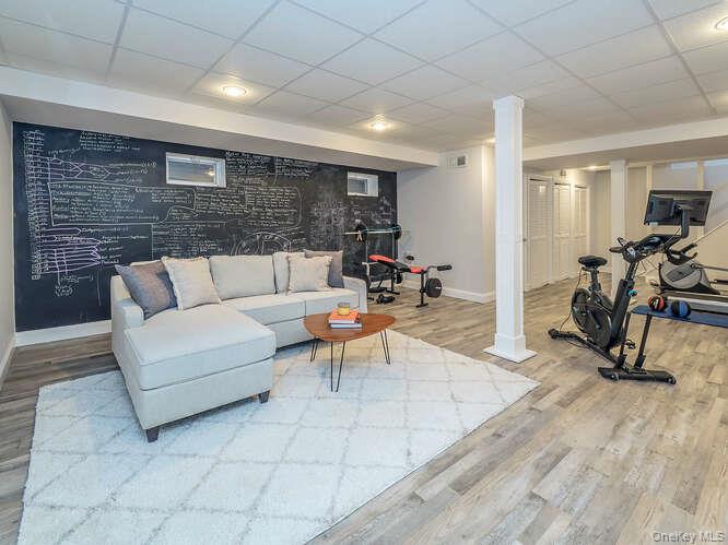 23 Ivy Way Port Washington, NY 11050 - Photo 39 of 47 a living room with furniture and a wooden floor