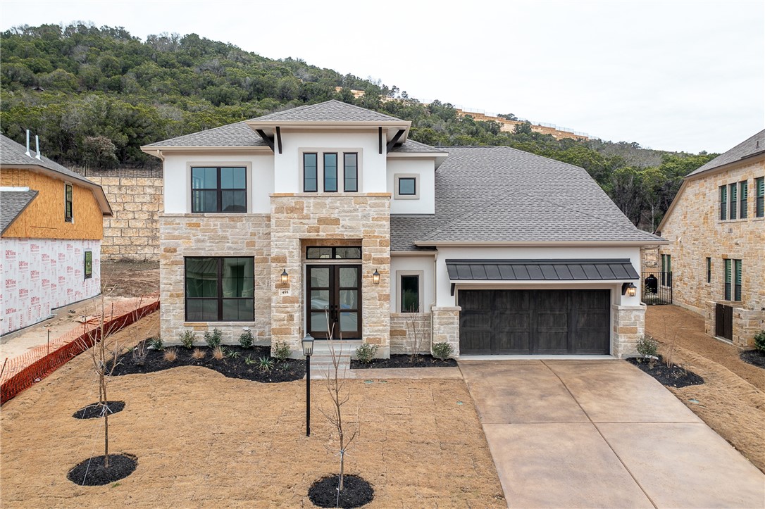 a front view of a house with yard