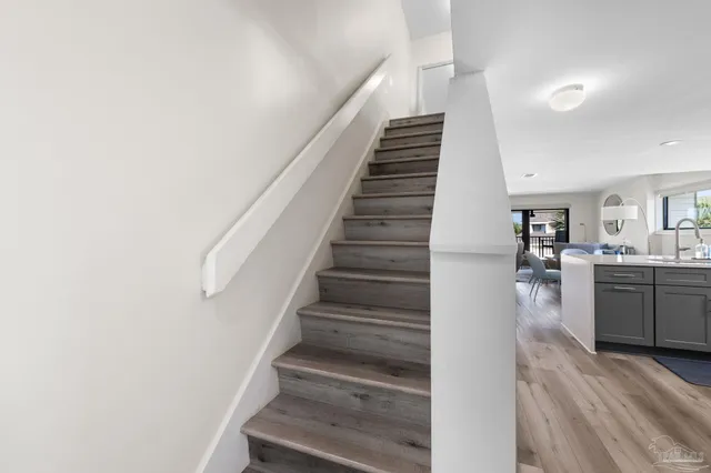 a view of entryway and hall with wooden floor