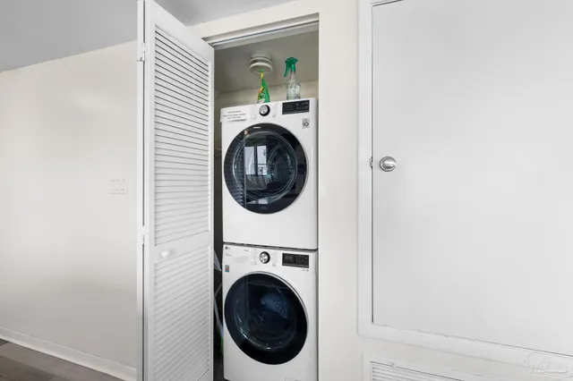 a view of a hallway with washer and dryer
